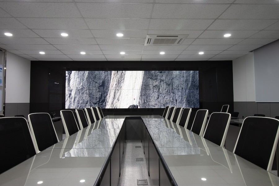 A board room with a waterfall video wall.